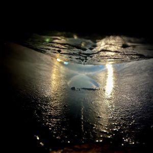 Chemical wash process for boiler maintenance, showcasing reflective surface and water droplets, emphasizing cleanliness and servicing quality.